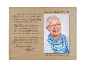 May include: A wooden photo frame with a light wood finish. The frame has a photo of a woman with short gray hair and glasses. The frame has an inscription that reads "I thought of you with love today, but that is nothing new. I thought about you yesterday, and days before that too. I think of you in silence, I often speak your name, all I have are memories, and your picture in a frame. Your memory's my keepsake, with which I'll never part. God has you in his keeping, I have you in my heart. Sally Mae Smith, January 14, 1936 - May 2, 2018"