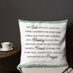 May include: White throw pillow with green Celtic knot border. The pillow features a text-based Irish blessing that reads: "May God give you, for every storm, a rainbow for every tear, a smile, for every care, a promise, and a Blessing in each trial. For every problem life sends, a faithful Friend to share, for every sigh, a sweet song, and an answer for each Prayer. Irish Blessing."