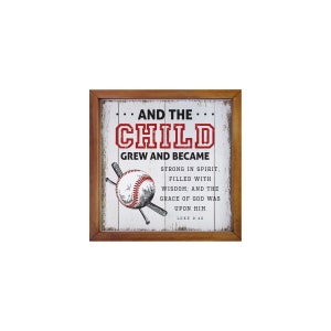 May include: A wooden framed sign with a white background and red text that reads "... AND THE ... CHILD GREW AND BECAME STRONG IN SPIRIT. FILLED WITH WISDOM; AND THE GRACE OF GOD WAS UPON HIM LUKE 2:40". A baseball and crossed bats are depicted in black and white.