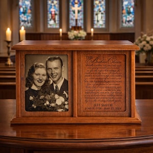 May include: A wooden memorial urn with a framed black and white photo of a couple. The right side features a poem titled "The Broken Chain" and the name "Jeff Smith" with dates.