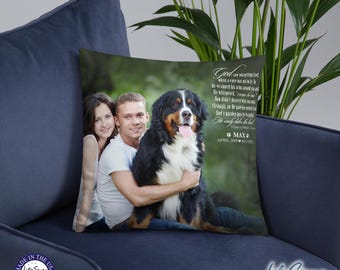 May include: A memorial pillow featuring a photo of a couple with their Bernese Mountain Dog. The pillow has a green background with a white text overlay that reads "God saw you getting tired, when a cure was not to be. He wrapped his arms around you and whispered, 'Come home with me.' You didn't deserve the pain and suffering, so he took you to his garden where there is no more pain and suffering. He only takes the best. The only takes the best. MAX April 2007 - July 2022"