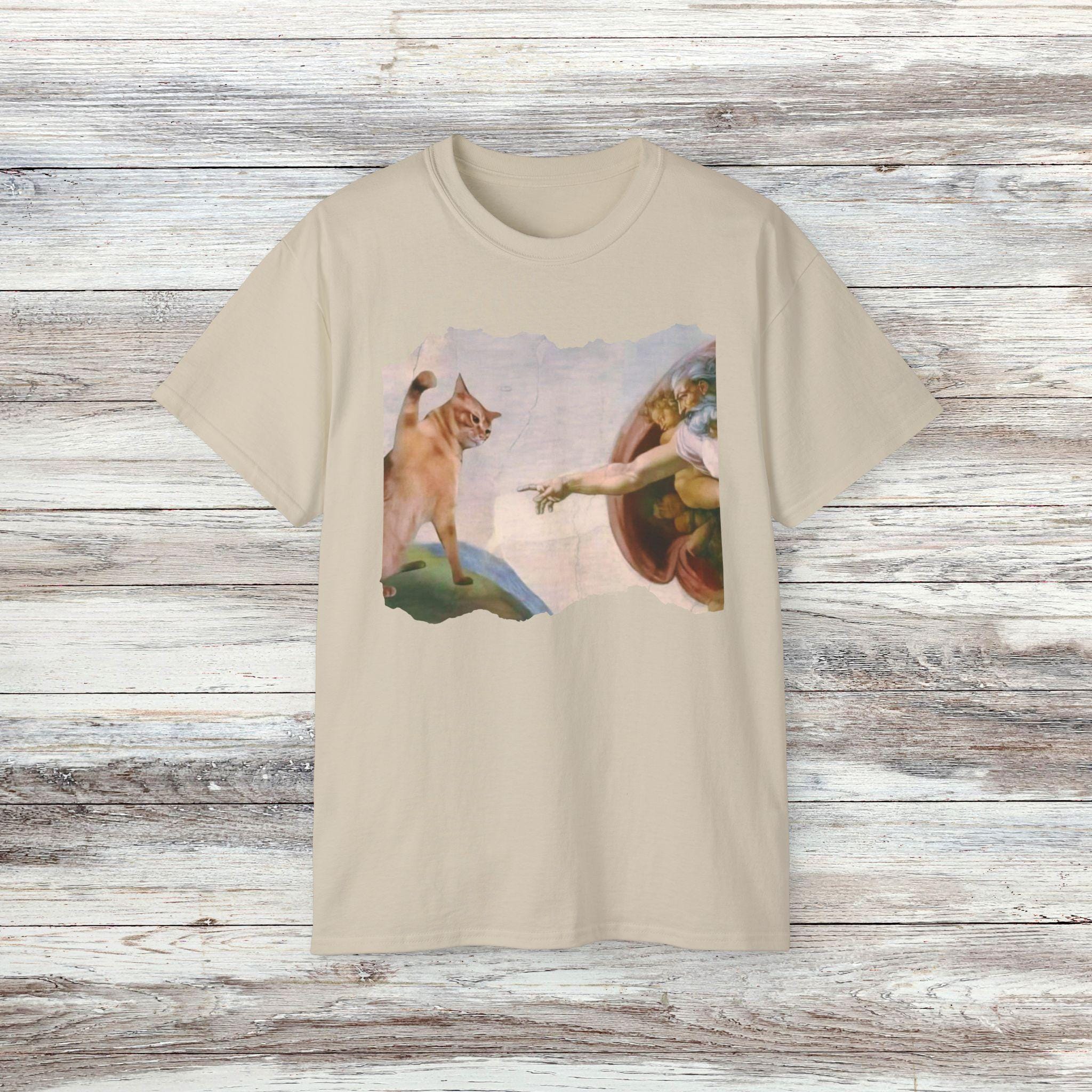 The Divine Swipe T-shirt - Funny Cat Swatting God's Hand
