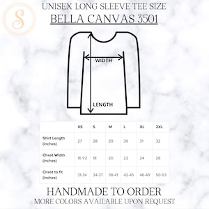 K&ouml;nnte beinhalten: Gr&ouml;&szlig;entabelle f&uuml;r ein Unisex-Langarmshirt von Bella Canvas, Modell 3501. Die Tabelle zeigt die Ma&szlig;e in Zoll f&uuml;r die Gr&ouml;&szlig;en XS, S, M, L, XL und 2XL. Die Ma&szlig;e umfassen die Shirtl&auml;nge, die Brustweite und die Brustweite.