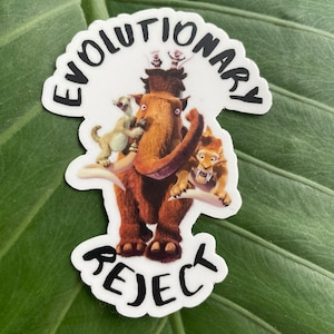 May include: White sticker with a cartoon image of a mammoth with a sloth, a monkey, and a saber-toothed tiger on its back. The text "Evolutionary Reject" is written around the image.