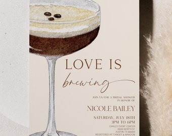 May include: A beige invitation card with a watercolor illustration of a coffee cocktail. The text on the card reads "Love is brewing" and "Nicole Bailey".