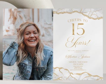 May include: A rectangular invitation card featuring a photograph of a smiling person in a denim jacket on the left and white text on the right that reads Cheers to 15 Years, with gold foil-style marble patterns bordering the top and bottom edges.