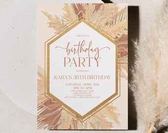 May include: A beige and gold birthday party invitation with a watercolor background of dried pampas grass. The text reads "birthday party" in gold script and "Kara's 30th Birthday" in brown script.