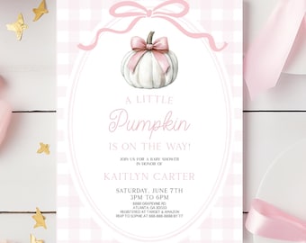 May include: A rectangular baby shower invitation card featuring a light pink and white gingham background, a central oval frame with a pink ribbon bow, and a white pumpkin illustration. The text reads A LITTLE PUMPKIN IS ON THE WAY!