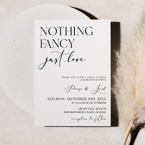 May include: A white wedding invitation with black text that reads "Nothing Fancy just love." The invitation includes the names "Paige & Josh", the date "Saturday, September 8th, 20XX", the time "at 4 o'clock in the afternoon", the location "Grapevine Ranch", and the address "8888 Grapevine Rd Atlanta, GA 30033". The invitation also includes the text "reception to follow".