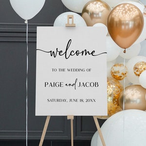 Peut inclure: Une pancarte d'accueil blanche avec du texte noir sur un chevalet. La pancarte indique "welcome to the wedding of Paige and Jacob Saturday, June 18, 20XX".