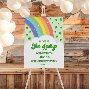 Dos carteles de bienvenida para el segundo cumpleaños de San Patricio con trébol de cuatro hojas y arcoíris, póster editable con caballete y tablero de espuma B41