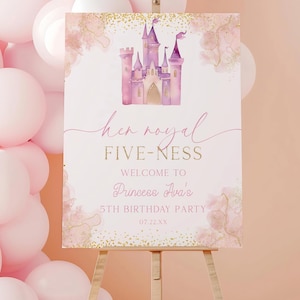 May include: A pink and gold welcome sign on a wooden easel. The sign features a watercolor illustration of a castle and the text "Her Royal Five-ness" and "Welcome to Princess Ava's 5th Birthday Party". Pink balloons are in the background.