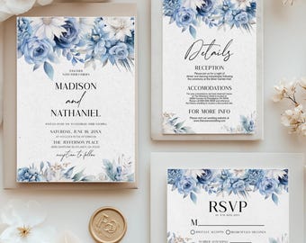 May include: Wedding invitation suite featuring blue floral designs. The set includes an invitation, details card, and RSVP card. The invitation displays the names "Madison and Nathaniel" and event details. A gold wax seal and white flowers are also present.