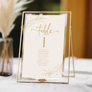 Plantilla minimalista para número de mesa de boda con hojas y ramas (con nombres) / Tarjeta imprimible con número de mesa en dorado y beige editable B45