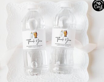 May include: Two clear plastic water bottles with white caps. Each bottle has a label that says "Thank You" with a baby bottle and beer mug graphic. The text below reads "For showering our little one with love, Kaitlyn's baby shower."