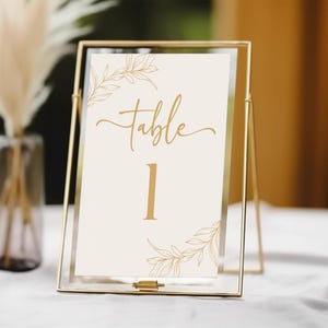 Modelo de número de mesa de casamento minimalista com folhas e galhos | Placa de número de mesa para impressão | Cartão de número de mesa bege dourado editável B45