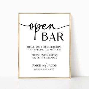 May include: A printable sign with a gold frame that says "open bar" in a cursive font. The sign also includes the text "Thank you for celebrating our special day with us! Please enjoy drinks on us this evening. Paige and Jacob Saturday, June 18, 20XX".