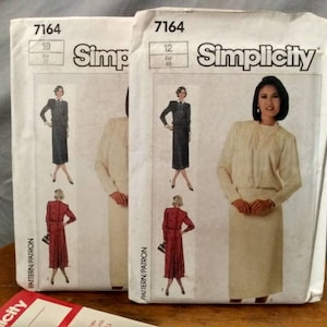 May include: Two Simplicity sewing pattern envelopes for a dress. The pattern numbers are 7164. The envelope on the left shows sizes 10-18 and the envelope on the right shows sizes 12-20.