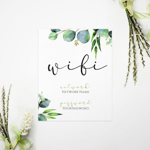 May include: A printable sign with a watercolor eucalyptus design. The sign says "wifi" and has placeholders for the network name and password.
