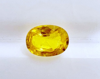 Natural Yellow Sapphire 7x5 mm Oval Shaped Gemstone, Weight- 1.12 carats, Colour- lemon yellow, HEATED beryllium, Quality- VS, loosegemstone