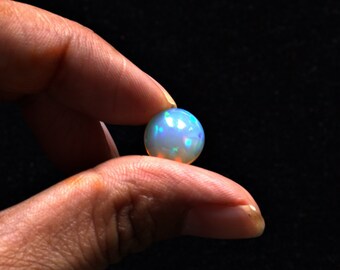 Natural Ethiopian Opal 10.8 mm Round shaped Cabochon gemstone, Weight-3.15 carats, Bright orange and green fire, Loose gemstone