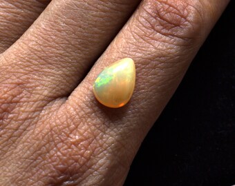 Natural Ethiopian Opal 12.1x8.8 mm Pear shaped Cabochon gemstone, Weight-2.60 carats, Bright orange and green fire Loose Gemstone