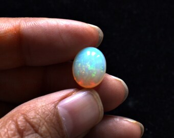 Natural Ethiopian Opal 12.2x9.8 mm Oval shaped Cabochon gemstone, Weight-3.20 carats, Bright orange and green fire, Loose gemstone