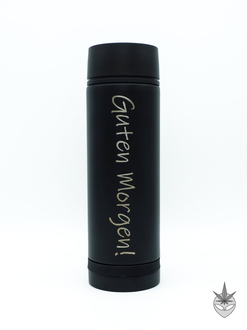 May include: A black stainless steel water bottle with the text "Guten Morgen!" engraved in silver lettering.