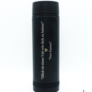 May include: Black stainless steel water bottle with an engraved quote in German: "Gl&uuml;ck ist einen Vati wie dich zu haben!" "Dein Kasimir"  The quote translates to "Happiness is having a dad like you!" "Your Kasimir"