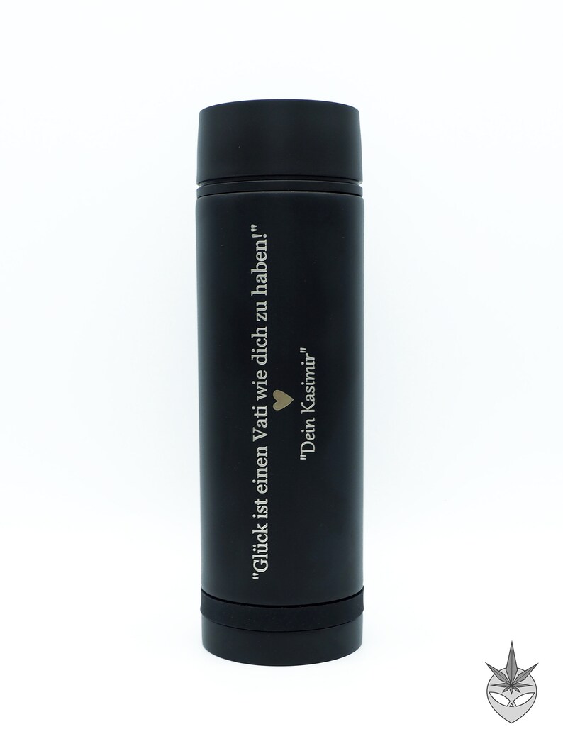 May include: Black stainless steel water bottle with an engraved quote in German: "Gl&uuml;ck ist einen Vati wie dich zu haben!" "Dein Kasimir"  The quote translates to "Happiness is having a dad like you!" "Your Kasimir"
