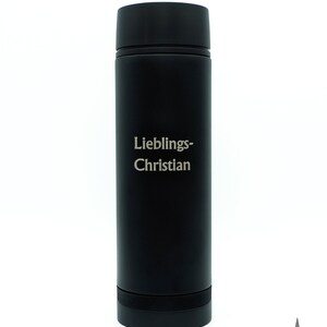 May include: A black stainless steel water bottle with the text "Lieblings-Christian" engraved on the side.