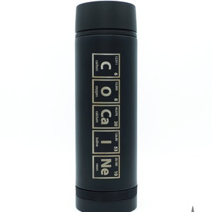 May include: Black stainless steel water bottle with a gold design featuring the chemical symbols and names for carbon, oxygen, calcium, iodine, and neon. The text reads "COCa|Ne".