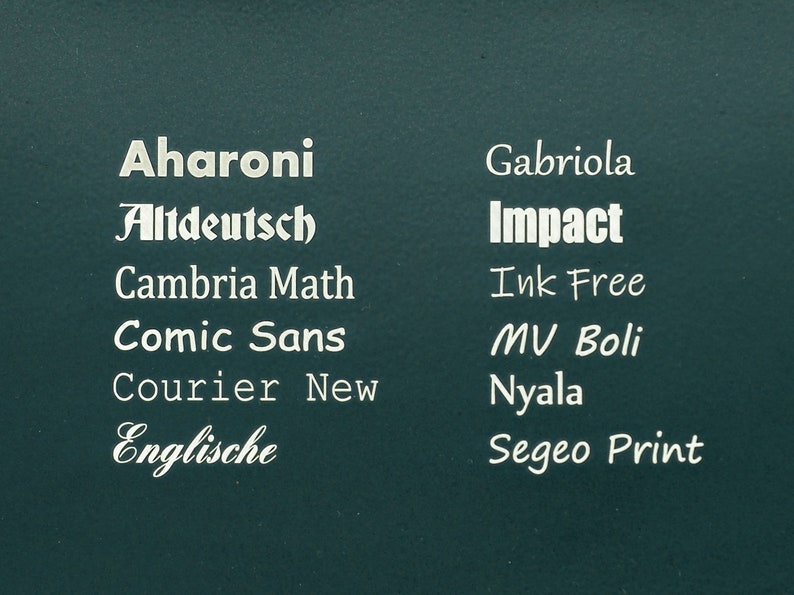 May include: A teal green background with a list of different font names in white text. The font names are: Aharoni, Altdeutsch, Cambria Math, Comic Sans, Courier New, Englische, Gabriola, Impact, Ink Free, MV Boli, Nyala, and Segeo Print.
