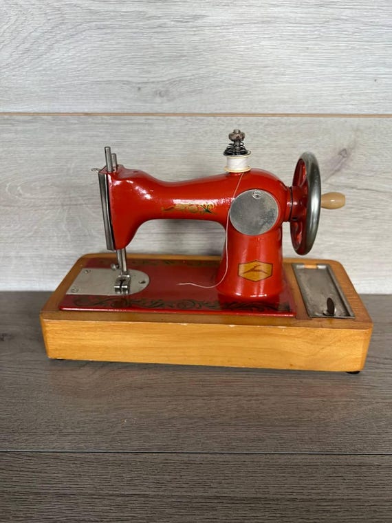 Vintage Children's Sewing Machine: Orange Metal USSR Toy, 1970s