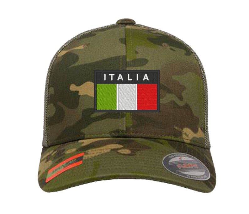 May include: A camouflage trucker hat with a black patch featuring the Italian flag and the word "ITALIA" in white text.