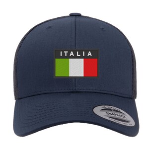 May include: A navy blue trucker hat with a black mesh back. The hat features a white patch with the Italian flag and the word "ITALIA" in white letters.
