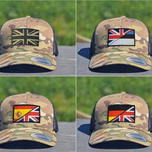 May include: Camouflage baseball caps with a black mesh back and a curved peak. Each cap features a flag patch: the United Kingdom, Estonia, Spain, and Germany. The caps are displayed on a wooden surface.