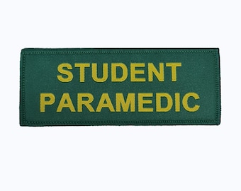 May include: Green rectangular patch with the text "STUDENT PARAMEDIC" in yellow embroidery.