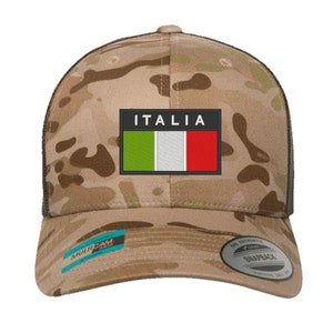 May include: A camouflage trucker hat with a black mesh back. The front of the hat features a patch with the Italian flag and the word "ITALIA" in white letters.