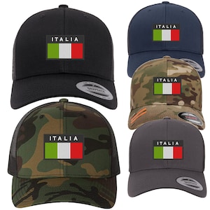 May include: Five trucker hats with a black, navy blue, camouflage, green camouflage, and gray color scheme. Each hat features a white and red Italian flag with the word "ITALIA" above it.