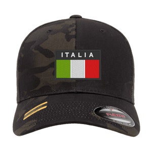 May include: Black camouflage baseball cap with a black patch featuring the Italian flag and the word "ITALIA" in white text.