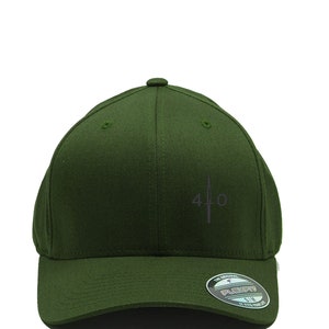 May include: A dark green baseball cap with a black and white logo that says "40" with a sword design. The cap has a black Flexfit label on the back.