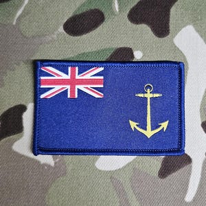 May include: An embroidered patch featuring the flag of the British Virgin Islands, with a gold anchor.
