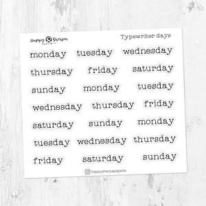 May include: A sheet of stickers with the days of the week written in a typewriter font. The stickers are white with black text and are arranged in rows. The text "Typewriter days" is at the top of the sheet.