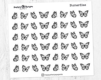 May include: A sheet of black and white butterfly stickers with the text "Butterflies" at the top. The stickers are arranged in a grid pattern.
