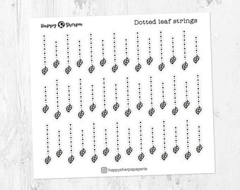 May include: A sheet of white sticker paper with black and white dotted leaf string stickers. The sheet has the text "Happy Sherpa" and "Dotted leaf strings" printed on it.
