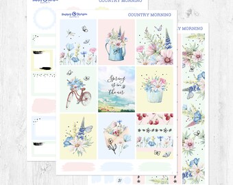 May include: A set of 12 floral themed planner stickers with a country morning theme. The stickers feature a variety of floral designs, including a bicycle with flowers, a watering can with flowers, and a floral envelope. The stickers are perfect for adding a touch of spring to your planner.