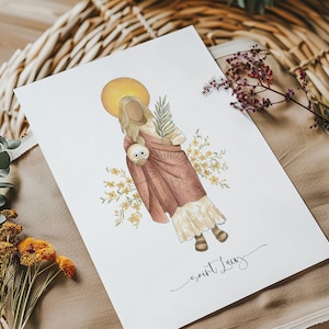 May include: Watercolor illustration of Saint Lucy, depicted with a halo, holding a palm branch and an owl. The saint is wearing a flowing dress and a brown cloak, surrounded by yellow flowers. The words "saint Lucy" are written in cursive.