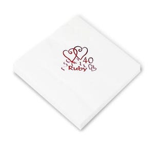 May include: White paper napkin with a red and black design of two intertwined hearts with the text "40 Ruby" in the centre.
