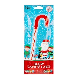 May include: A red and white striped glow candy cane in a package with a blue background and snowflakes. The package features Santa Claus, two elves, and the text "GLOW CANDY CANE".